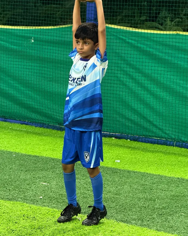 NexGen player stretching before a training session